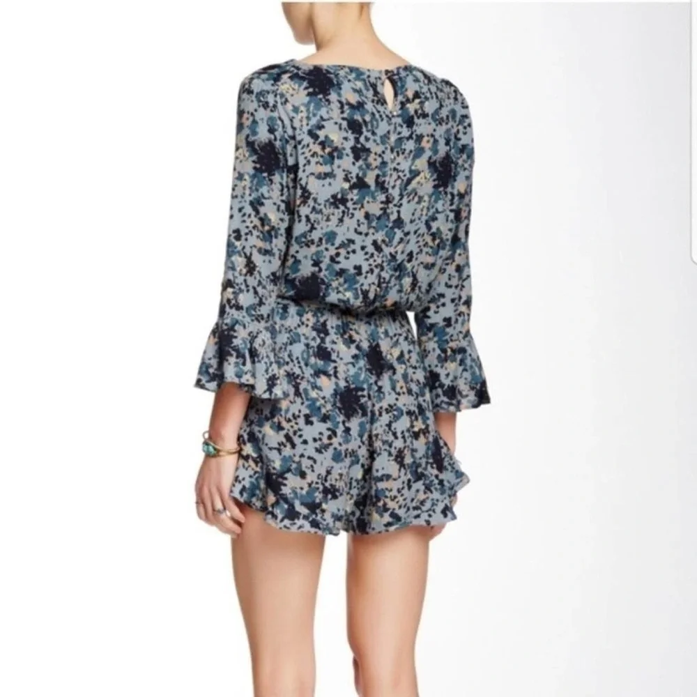 FREE PEOPLE “all the right ruffles” romper